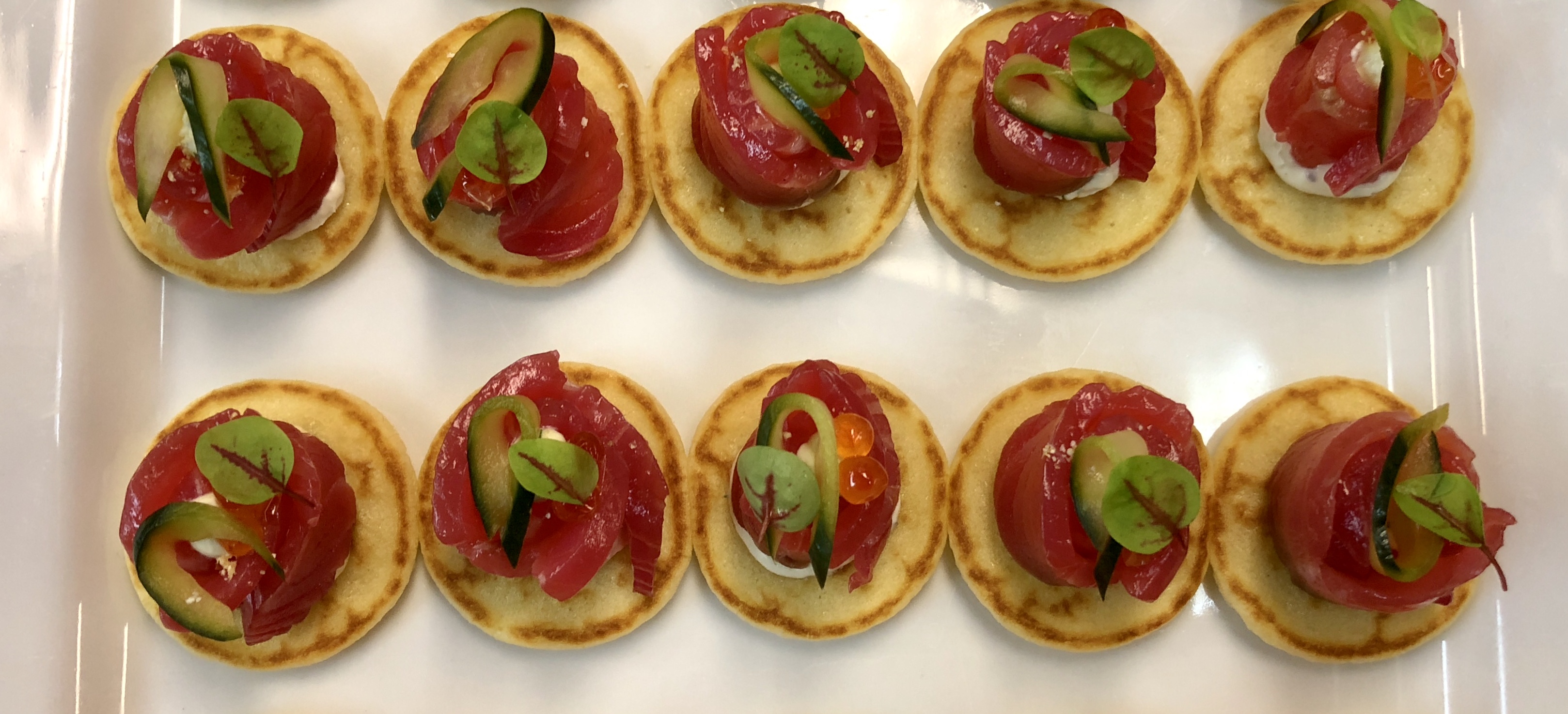 House cured Tasmanian salmon, dill cream cheese, pickled cucumber on blini